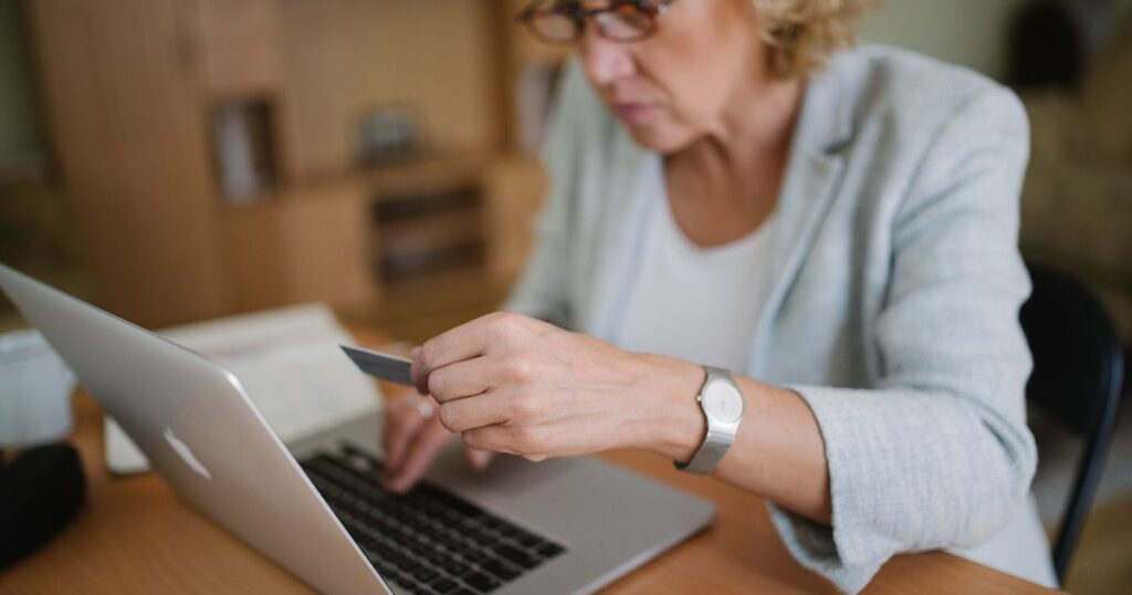 Office worker using a laptop at her desk