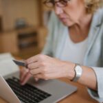 Office worker using a laptop at her desk