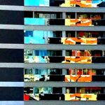 Colorful reflections across the windows of an office tower